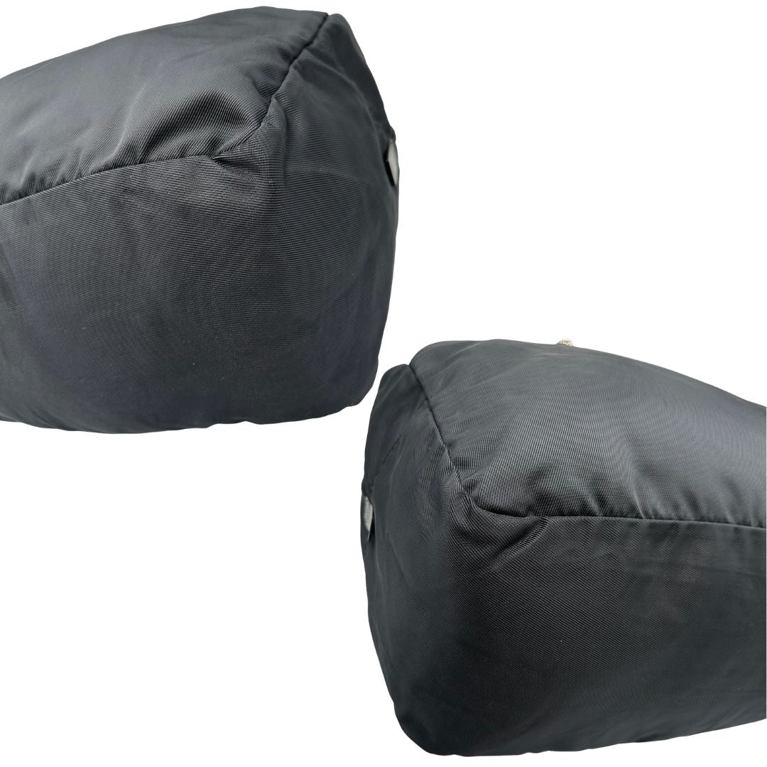 Angoli di un borsone Gucci in tela nera, con dettagli in pelle tono su tono, usato, originale, second hand, in ottime condizioni.