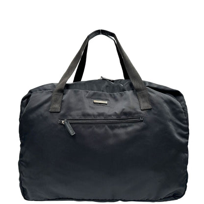 Front di un borsone Gucci in tela nera, con dettagli in pelle tono su tono, usato, originale, second hand, in ottime condizioni.