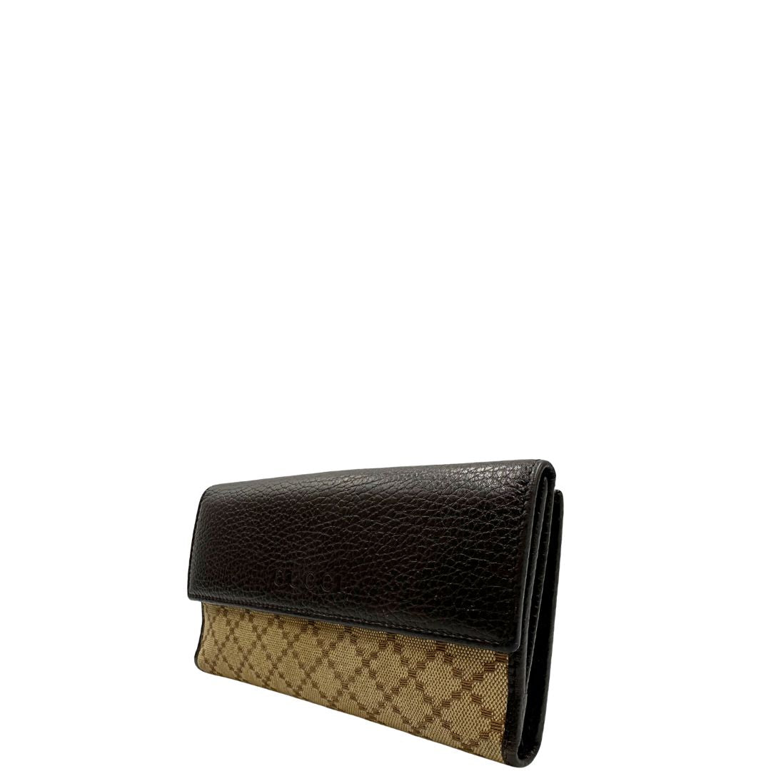 Portafoglio Gucci in pelle marrone e tessuto beige; munito di scatola, di lusso, originale, ottime condizioni, usato.