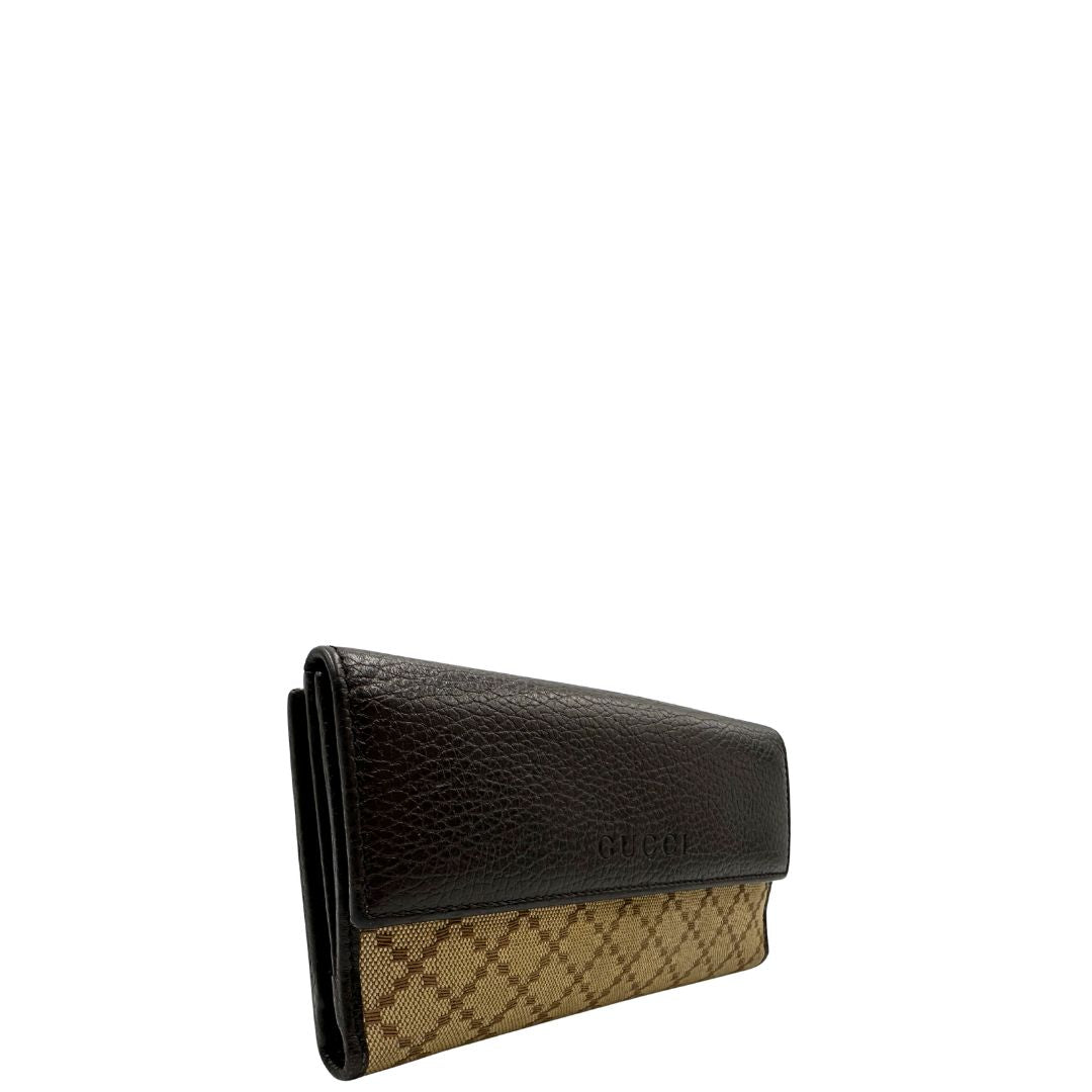 Portafoglio Gucci in pelle marrone e tessuto beige; munito di scatola, di lusso, originale, ottime condizioni, usato.