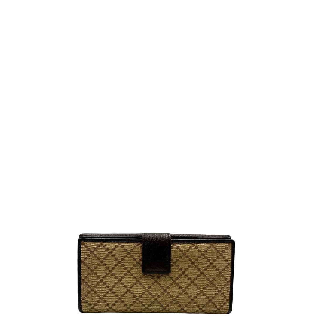 Portafoglio Gucci in pelle marrone e tessuto beige; munito di scatola, di lusso, originale, ottime condizioni, usato.