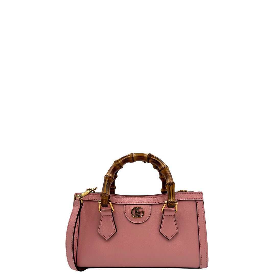 front Borsa Gucci in pelle rosa, impreziosita da doppi manici bamboo e doppia G sul front in metallo dorato, di lusso, eccellenti condizioni. 