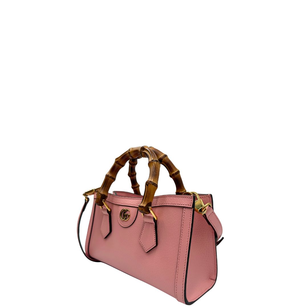 lato Borsa Gucci in pelle rosa, impreziosita da doppi manici bamboo e doppia G sul front in metallo dorato, di lusso, eccellenti condizioni. 