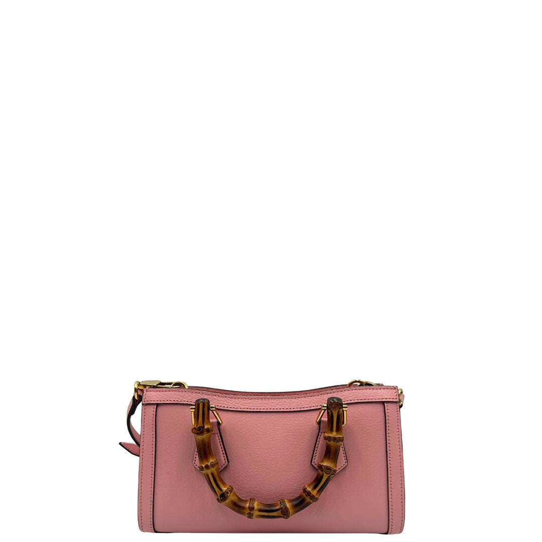 retro Borsa Gucci in pelle rosa, impreziosita da doppi manici bamboo e doppia G sul front in metallo dorato, di lusso, eccellenti condizioni. 
