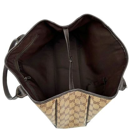 interno Borsa Gucci in tela cerata GG con finiture in pelle marroni, munita di doppi manici in pelle, impreziosita da dettagli Web verdi e rossi, di lusso, originale, ottime condizioni, usata. 