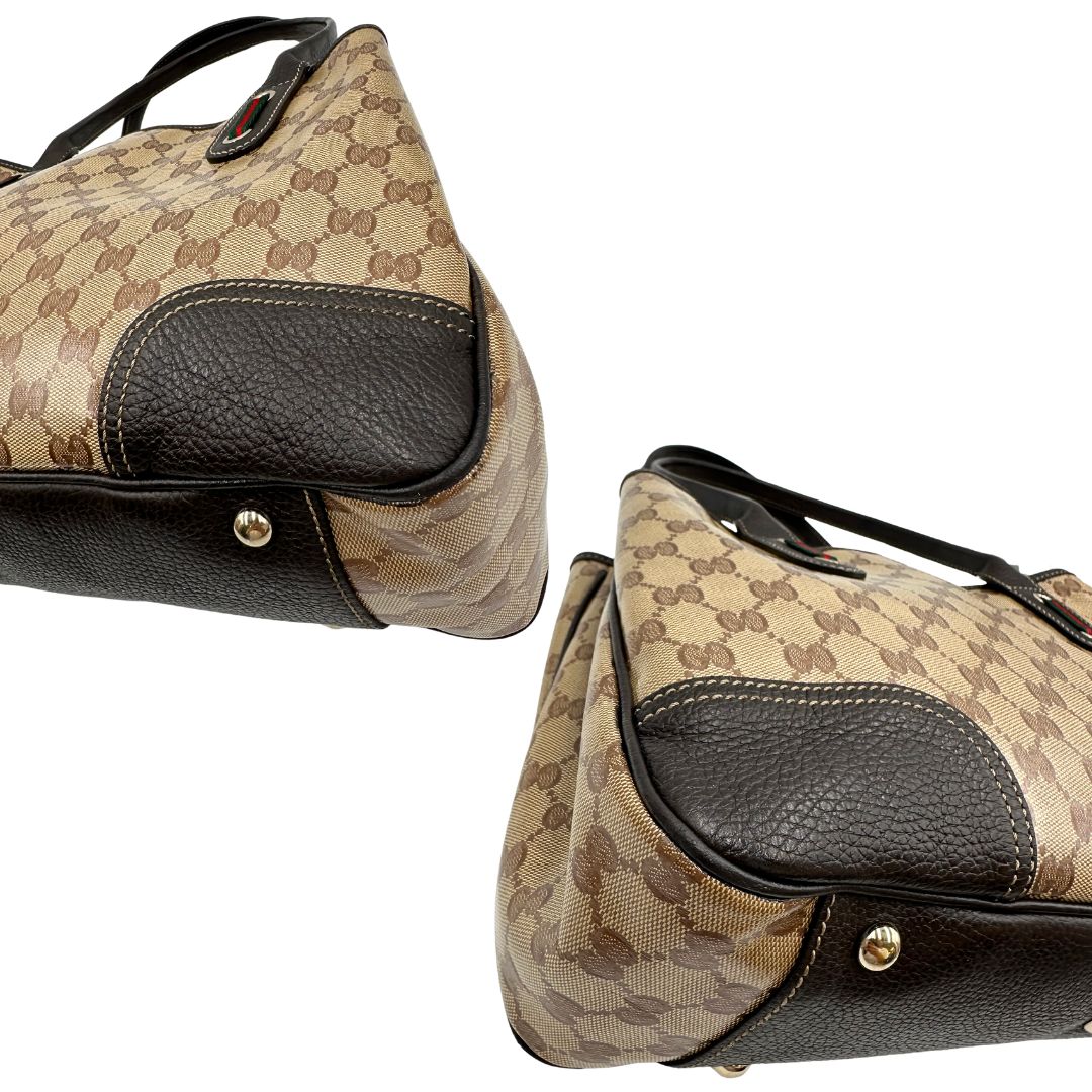 angoli Borsa Gucci in tela cerata GG con finiture in pelle marroni, munita di doppi manici in pelle, impreziosita da dettagli Web verdi e rossi, di lusso, originale, ottime condizioni, usata. 