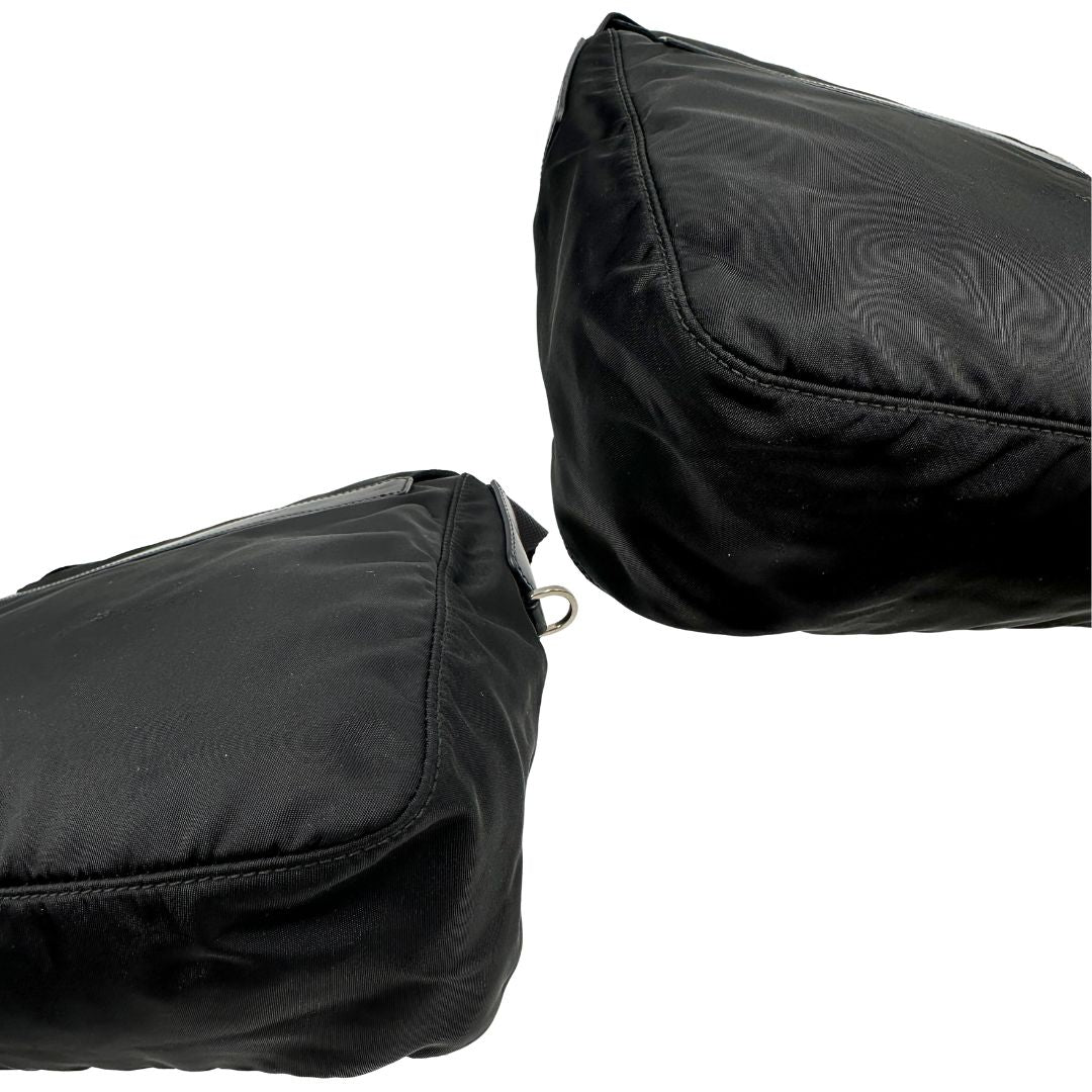 angoli Borsa Prada in nylon nero con finiture in pelle tono su tono; munita di una tracolla in tessuto regolabile, di lusso, originale, ottime condizioni. 