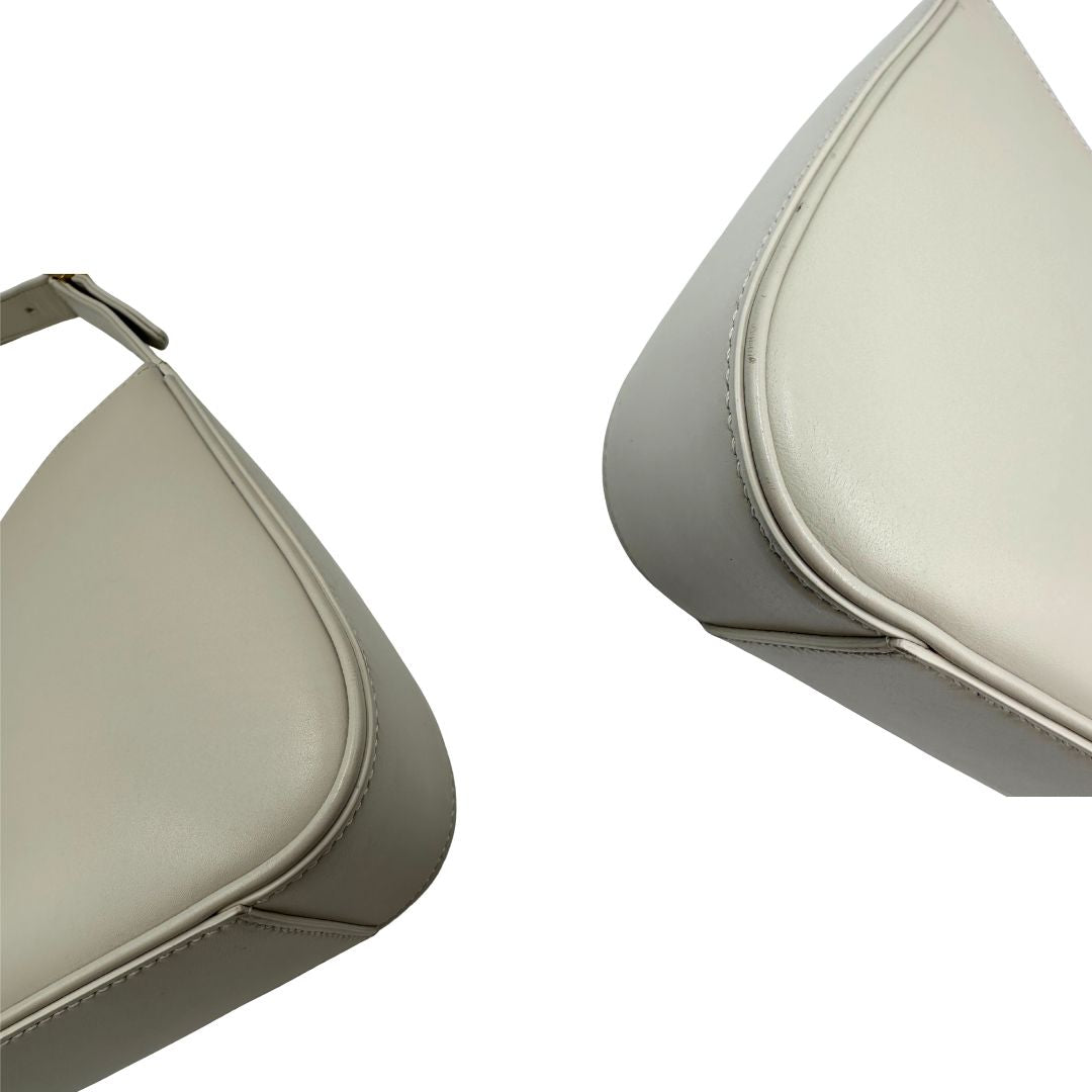 angoli Borsa Saint Laurent LE 5 À 7 in pelle bianca, compatta e spaziosa, puoi portarla a mano o a spalla, di lusso, originale, ottime condizioni, usata. 