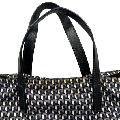 manici Borsa Prada in nylon stampato con motivo geometrico all-over nei toni del blu e bianco, arricchita da doppi manici in pelle nera, di lusso, originale, ottime condizioni, usata. 