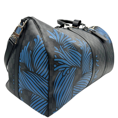 latol Borsone Louis Vuitton Keepall in tela Damier Graphite con stampa artistica nei toni del blu, di lusso, originale, ottime condizioni, usato. 
