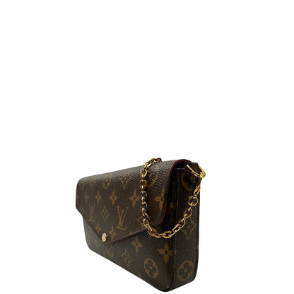 Laterale destro di una tracolla Louis Vuitton in canvas marrone monogram ed amaranto, con parti metalliche dorate. Munita di una tracolla in catena amovibile, ma non regolabile e di accessori estraibili portamonete e portacarte, usata, originale, second hand, in ottime condizioni.