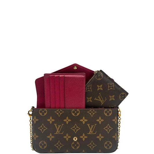 Front di una tracolla Louis Vuitton in canvas marrone monogram ed amaranto, con parti metalliche dorate. Munita di una tracolla in catena amovibile, ma non regolabile e di accessori estraibili portamonete e portacarte, usata, originale, second hand, in ottime condizioni.