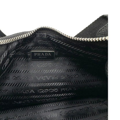 Borsa Prada in re-nylon nero con finiture in pelle saffiano tono su tono, di lusso, originale
