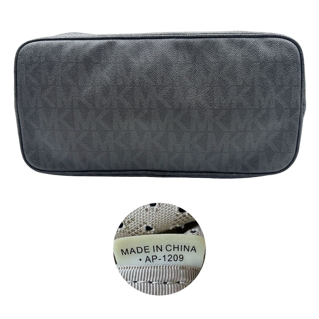 Borsa MK in pelle nera traforata e logata con hardware dorato, munita di doppi manici, da portare a spalla, di lusso, originale, ottime condizioni