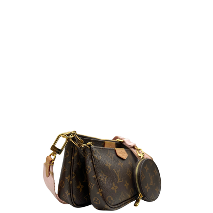 Laterale sinistro di una Multi Pochette Accessoires Louis Vuitton in canvas marrone monogram con dettagli in vacchetta naturale, manico in catena dorata e tracolla in tessuto Jacquard rosa, usata, originale, second hand, in ottime condizioni.