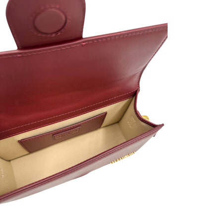 interno Borsa Jacquemus nella versione Le Grand Bambino in pelle color burgundy, da portare a mano o a tracolla, di lusso, originale, ottime condizioni, usata
