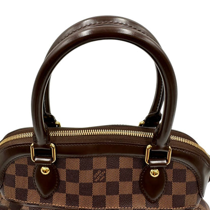 Manici di una borsa LV in canvas Damier Ébène nella versione MM, con dettagli metallici dorati, usata, originale, second hand, in ottime condizioni.