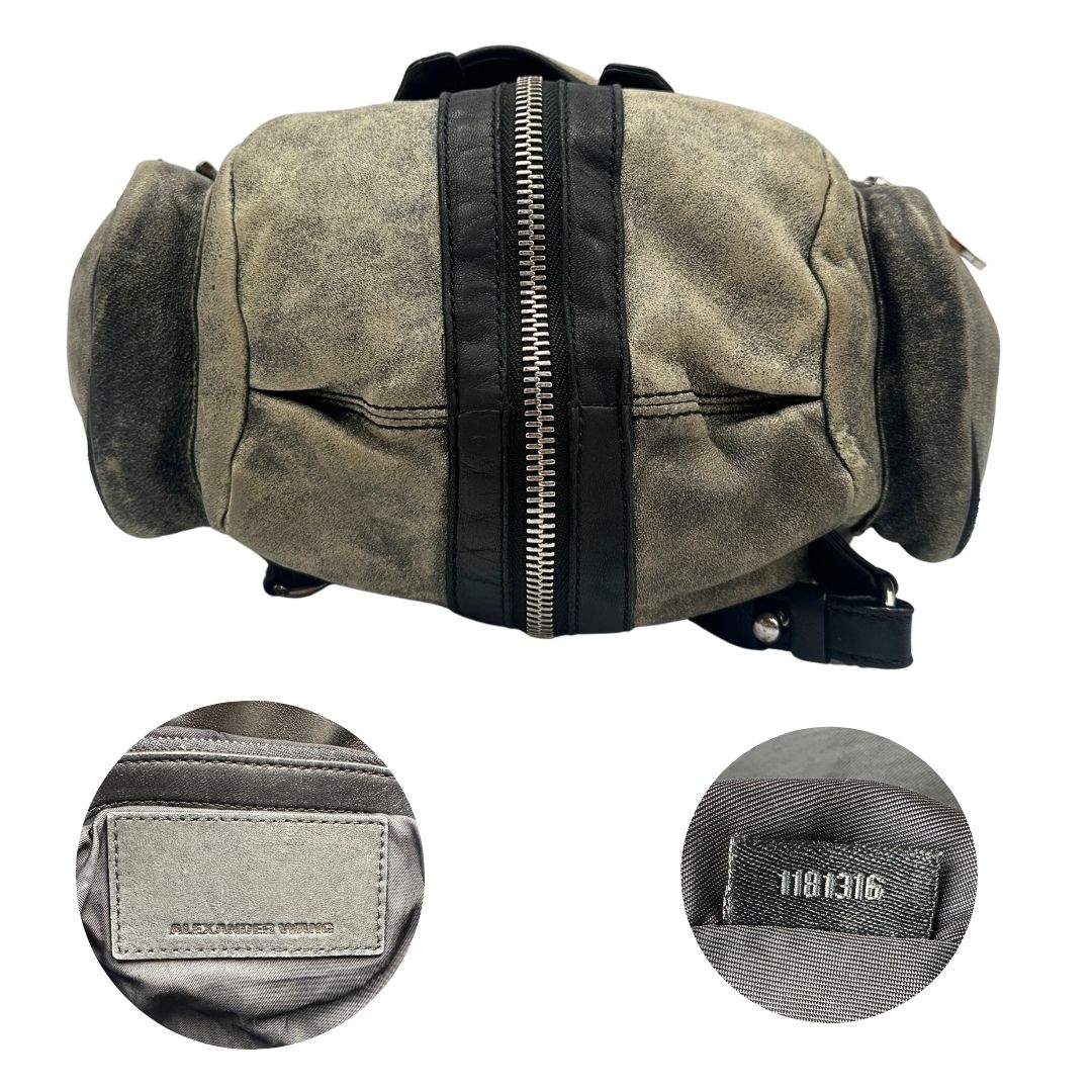 Base, codice e logo Zaino Marti in pelle verde oliva effetto washed e finiture nere con hardware argentato. Originale, di lusso, usato, in condizioni ottime. 