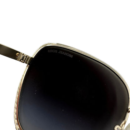 Occhiali da sole Michael Kors in metallo dorato con logo MK sulle asticelle