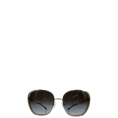 Occhiali da sole Michael Kors in metallo dorato con logo MK sulle asticelle