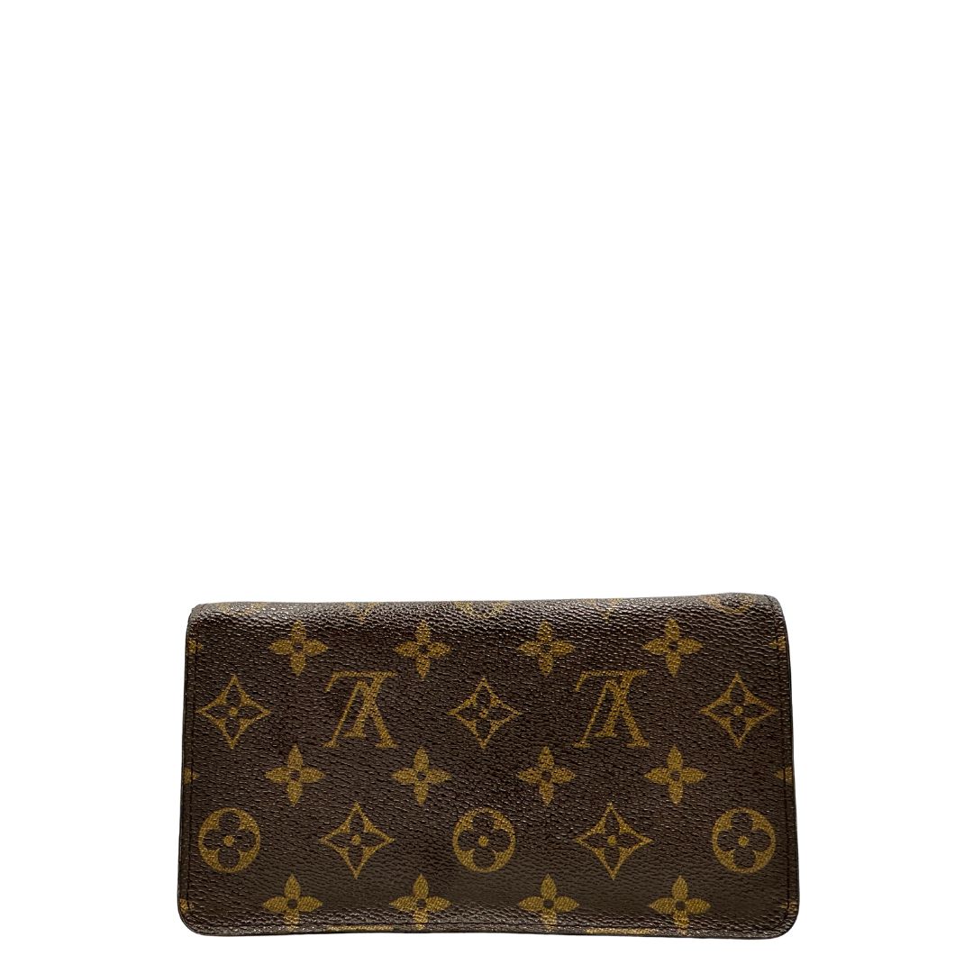 Retro Portafoglio compatto Louis Vuitton in canvas marrone monogram, con chiusura con cerniera e parti metalliche dorate. Originale, di lusso, usato, in condizioni ottime. 
