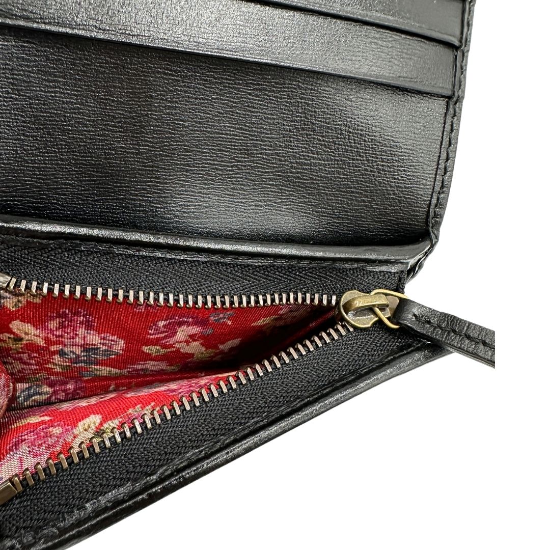 Portafoglio Gucci in pelle nera con dettaglio Web verde e rosso