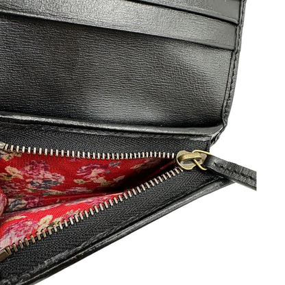 Portafoglio Gucci in pelle nera con dettaglio Web verde e rosso