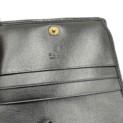 Portafoglio Gucci in pelle nera con dettaglio Web verde e rosso