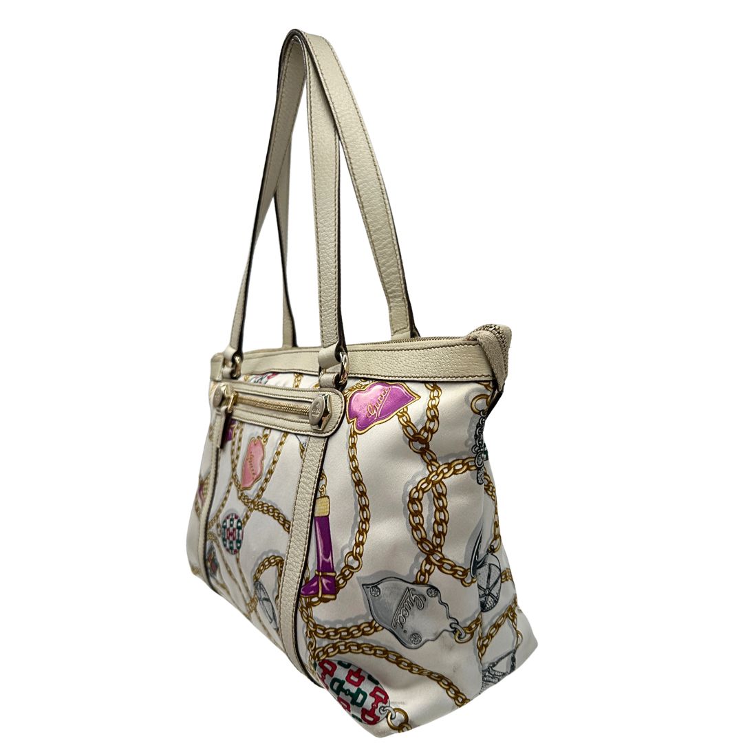 lato  Borsa Gucci in tessuto con trama multicolor e finiture in pelle color bianco gesso, di lusso, originale, ottime condizioni, usata 