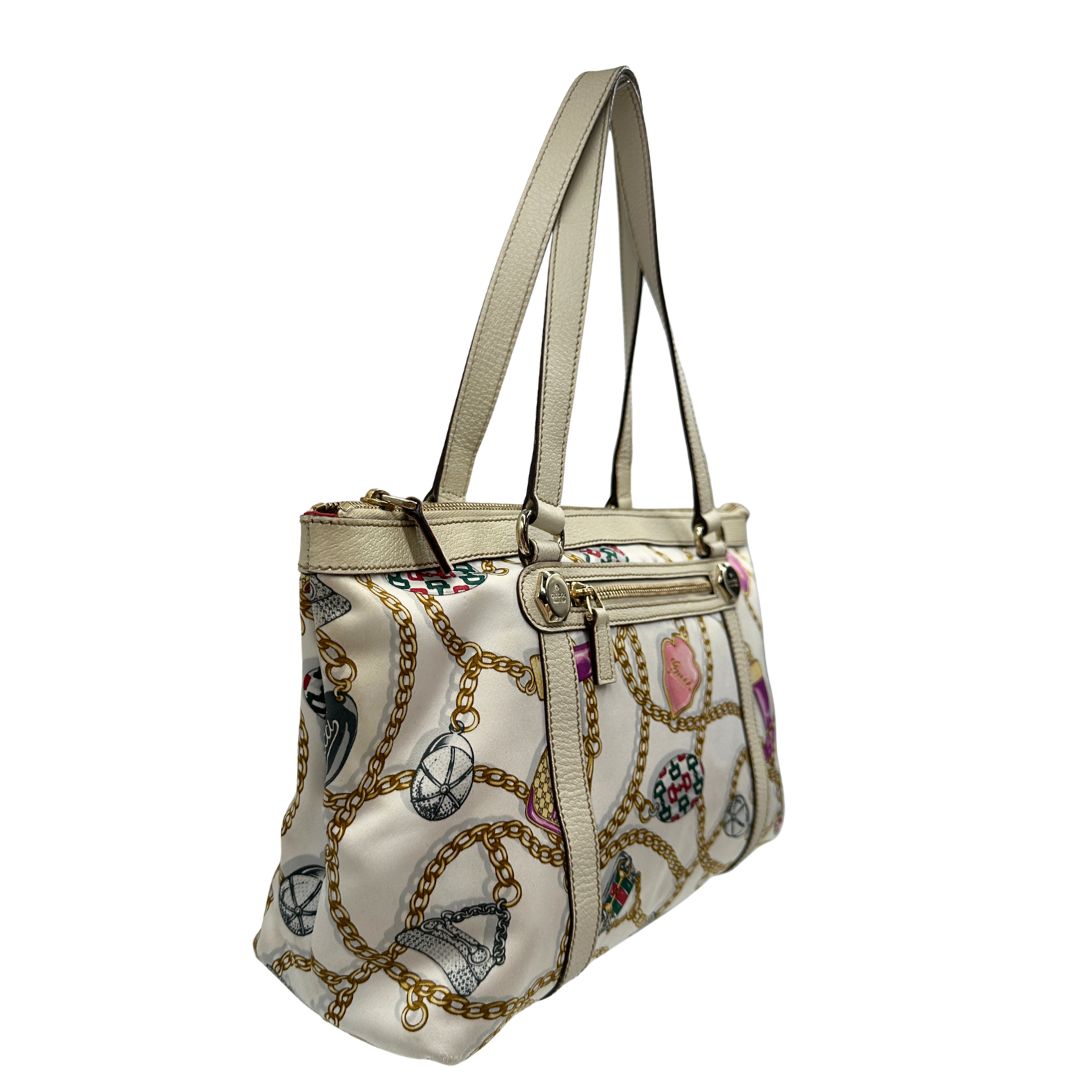 lato  Borsa Gucci in tessuto con trama multicolor e finiture in pelle color bianco gesso, di lusso, originale, ottime condizioni, usata 