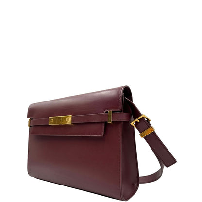 Borsa Saint Laurent Manhattan in pelle bordeaux e hardware dorato, da portare a spalla.