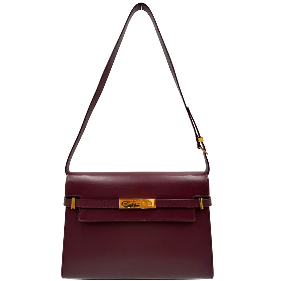 Borsa Saint Laurent Manhattan in pelle bordeaux e hardware dorato, da portare a spalla.