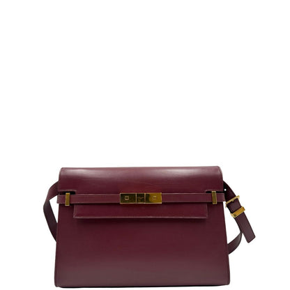 Borsa Saint Laurent Manhattan in pelle bordeaux e hardware dorato, da portare a spalla.