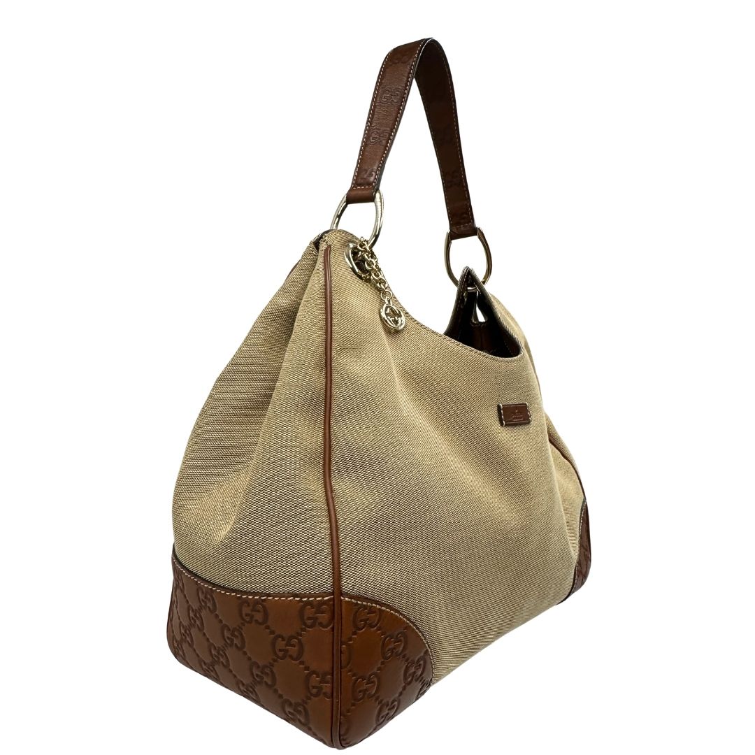 lato Borsa Gucci in tessuto color sabbia con finiture in pelle GG marrone