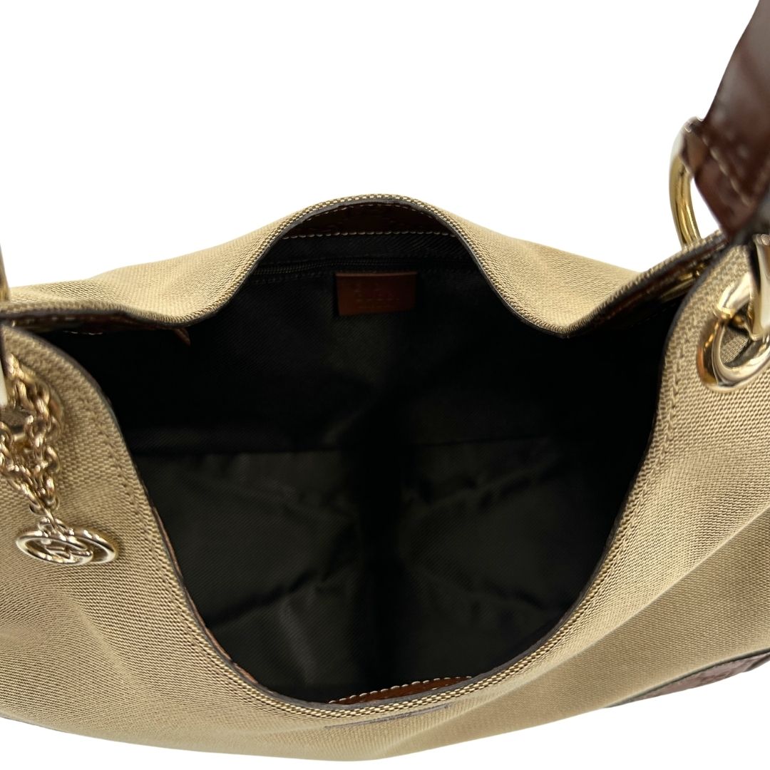 interno Borsa Gucci in tessuto color sabbia con finiture in pelle GG marrone 