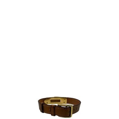 Elegante Hermès Année de la Fantaisie "Vive l'Idée!", bracciale in pelle marrone con finiture dorate e un caratteristico lucchetto a forma di cuore.