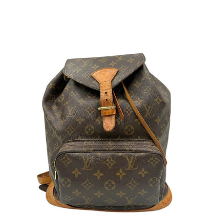 Front di uno zaino Montsouris GM in canvas marrone monogram con finiture in vacchetta naturale.