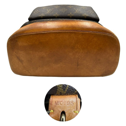 Base e codice di uno zaino Montsouris GM in canvas marrone monogram con finiture in vacchetta naturale.