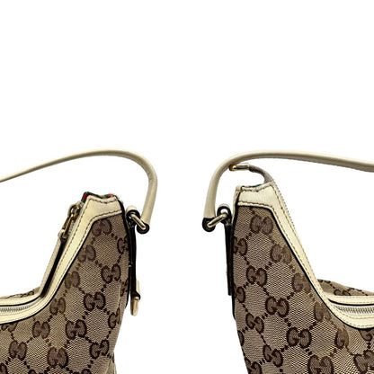 angoli manico Borsa Gucci in tessuto GG monogram beige con parti metalliche dorate e finiture in pelle; munita di un manico singolo, da portare a spalla