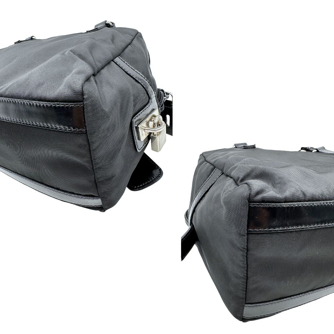 angoli Borsa Prada in nylon nero con finiture in pelle tono su tono e parti metalliche argentate; munita di doppi manici e accessorio porta address, di lusso, originale, ottime condizioni, usata. 