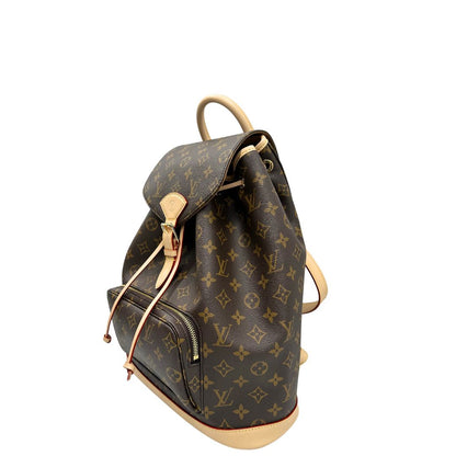 Laterale destro di uno zaino LV in canvas marrone monogram con finiture in vacchetta naturale e parti metalliche dorate; munito di due bretelle regolabili. Full set.