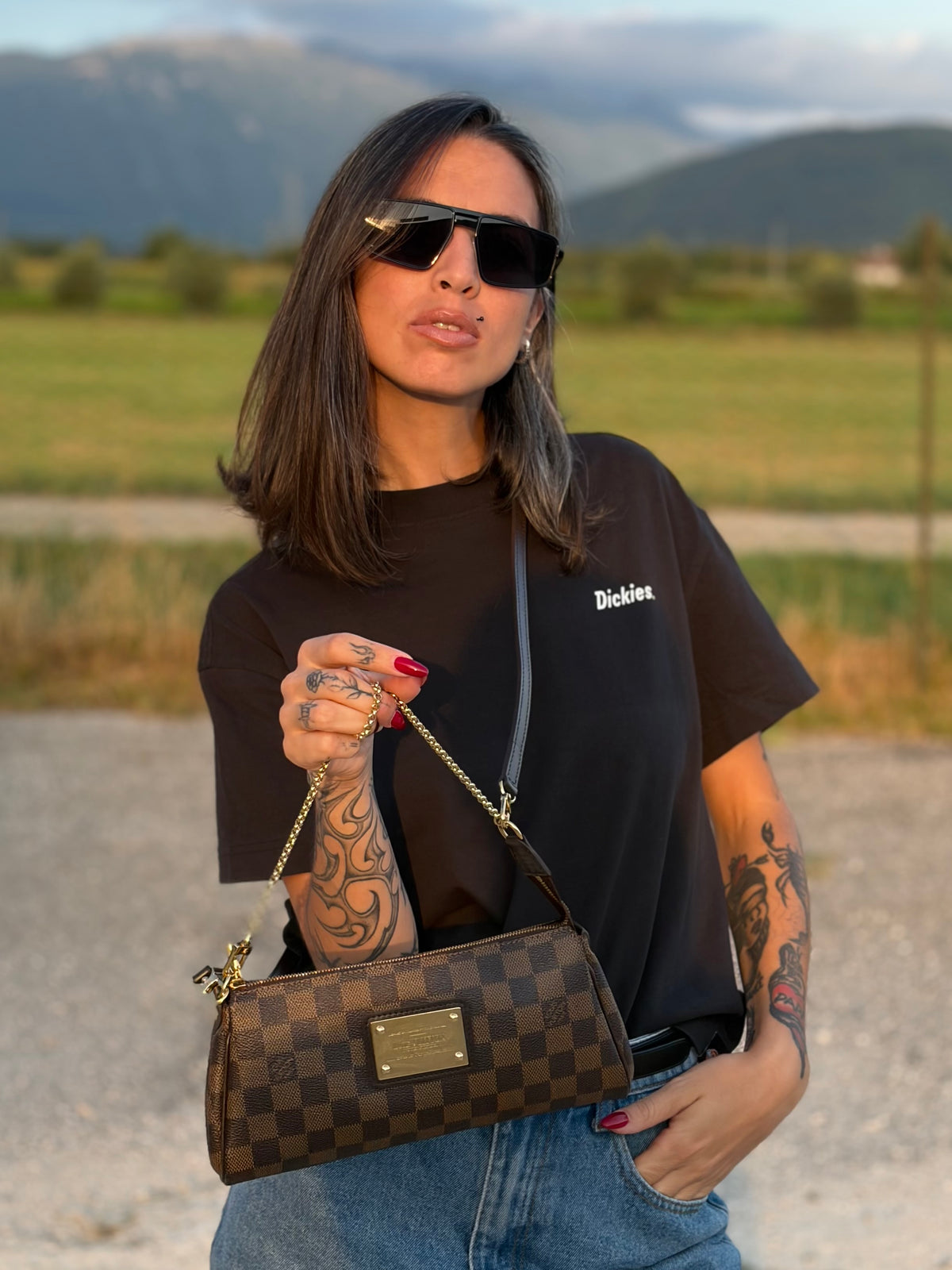Pochette Eva Damier Ébène Louis Vuitton
