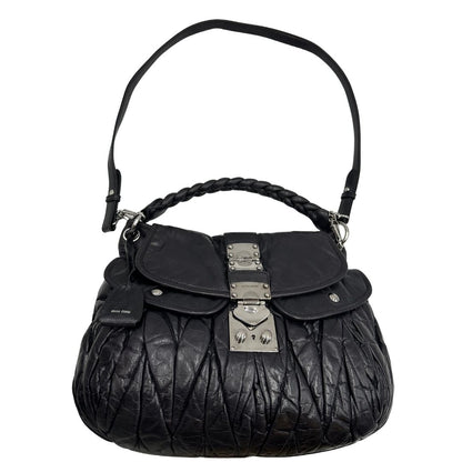 borsa Miu Miu realizzata in pelle color viola melanzana con lavorazione matelassé, caratterizzata da morbide arricciature, di lusso, originale, ottime condizioni, usata
