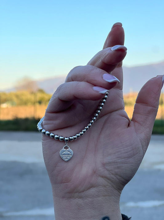 Bracciale Heart Tag Tiffany&Co. della collezione Return To Tiffany in argento 925 con ciondolo cuore. Completo di sacchetto antipolvere, di lusso, originale, ottime condizioni, usata.