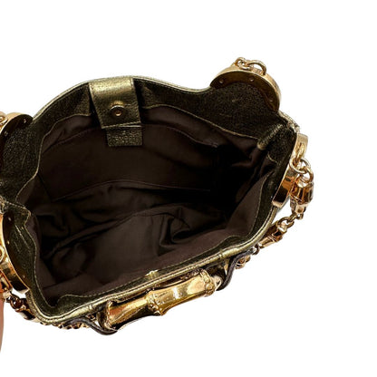 Interno Borsa Gucci Ring x Tom Ford in pelle martellata color oro verdastro effetto metallizzato con parti metalliche dorate e dettagli bamboo in metallo. Da indossare a spalla. Originale, usato, in condizioni ottime. 