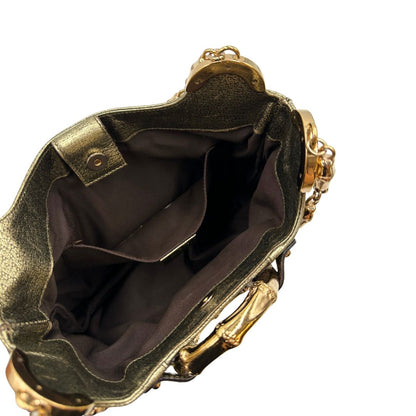 Borsa Gucci Ring x Tom Ford in pelle martellata color oro verdastro effetto metallizzato con parti metalliche dorate e dettagli bamboo in metallo. Da indossare a spalla. Originale, usato, in condizioni ottime. 
