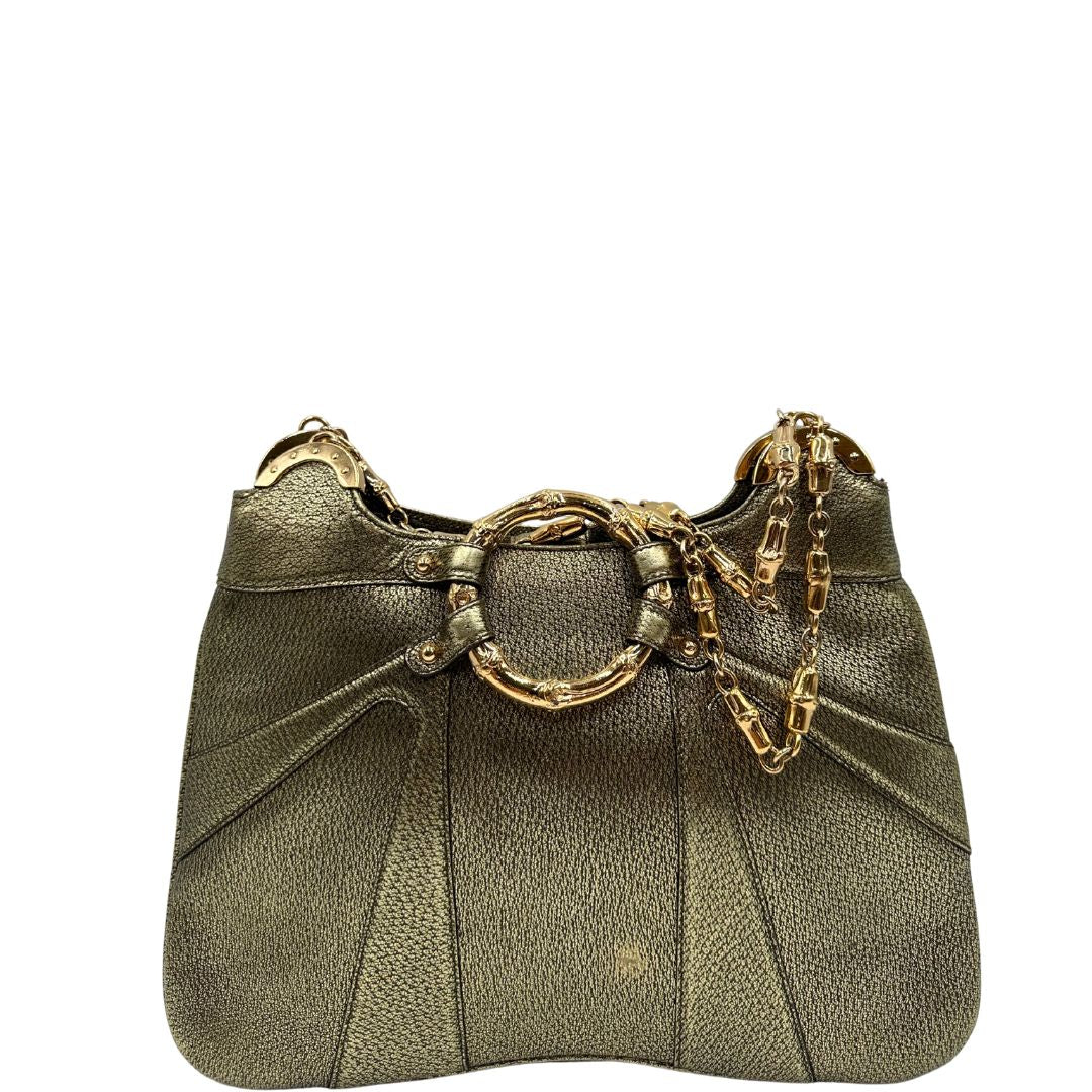 Borsa Gucci Ring x Tom Ford in pelle martellata color oro verdastro effetto metallizzato con parti metalliche dorate e dettagli bamboo in metallo. Da indossare a spalla. Originale, usato, in condizioni ottime. 