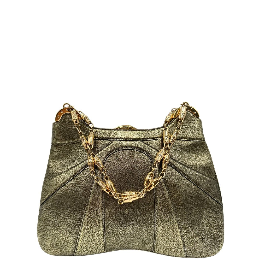 Borsa Gucci Ring x Tom Ford in pelle martellata color oro verdastro effetto metallizzato con parti metalliche dorate e dettagli bamboo in metallo. Da indossare a spalla. Originale, usato, in condizioni ottime. 