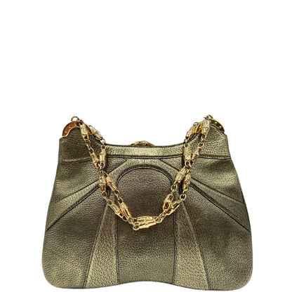 Borsa Gucci Ring x Tom Ford in pelle martellata color oro verdastro effetto metallizzato con parti metalliche dorate e dettagli bamboo in metallo. Da indossare a spalla. Originale, usato, in condizioni ottime. 