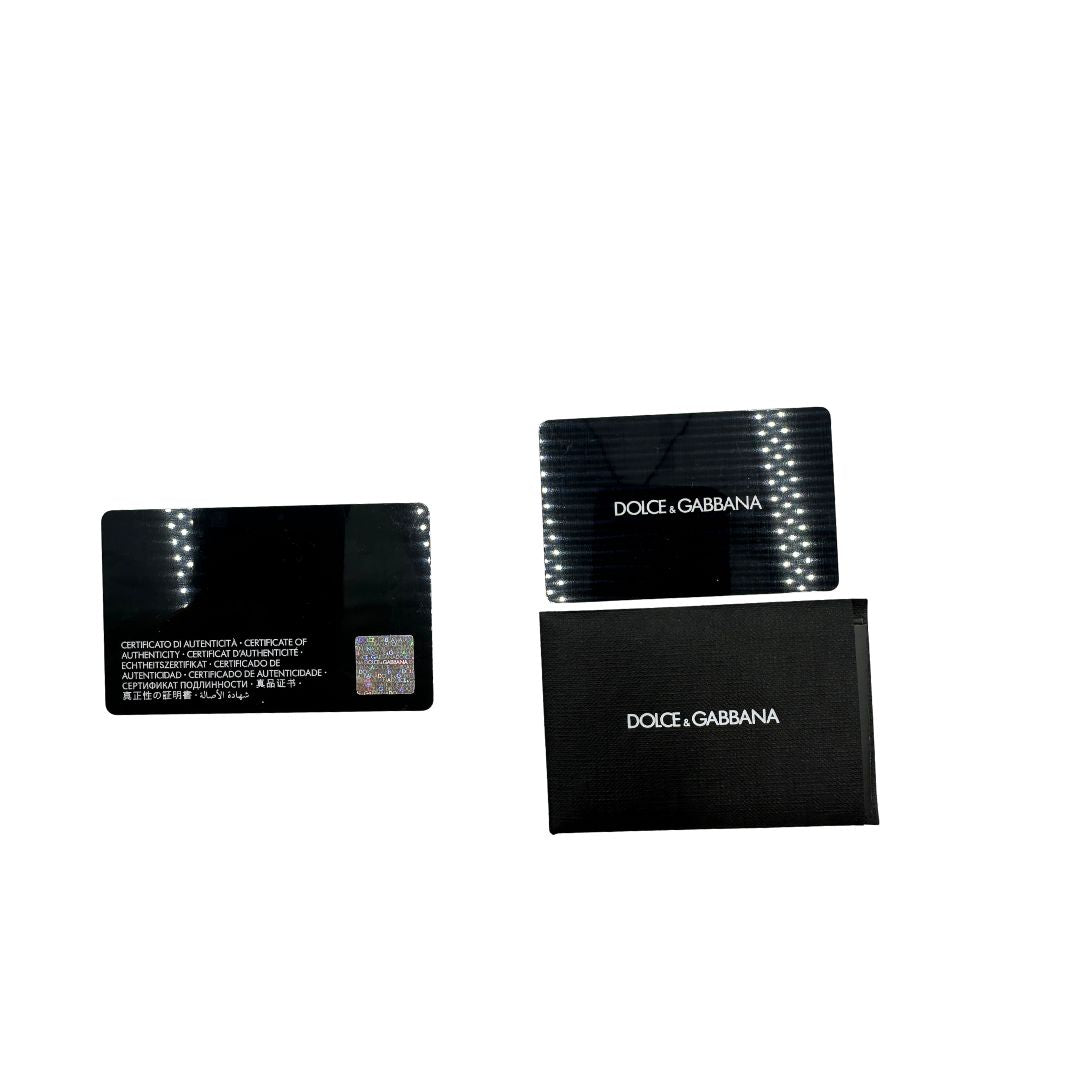 Marsupio D&G in nylon nero rifinito con parti metalliche effetto renio; munita di cinta regolabile con chiusura a gancio 